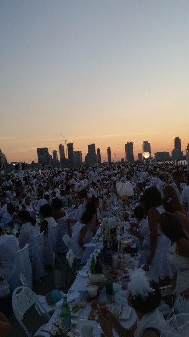 No, this isn't a Debutante Ball, it's just a LOT of ladies & gents at the Diner En Blanc keepin' it classy.